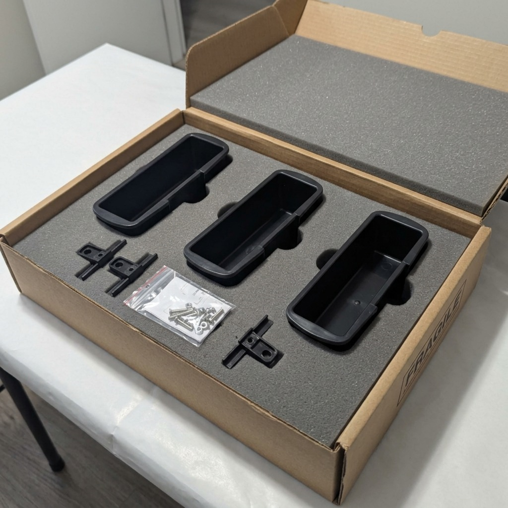 Rakabot Titan 3-container and hook kit securely packaged in a foam-lined shipping box with hardware.